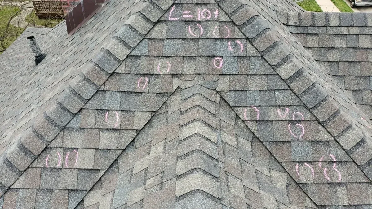 A close up of a roof with a lot of shingles on it.