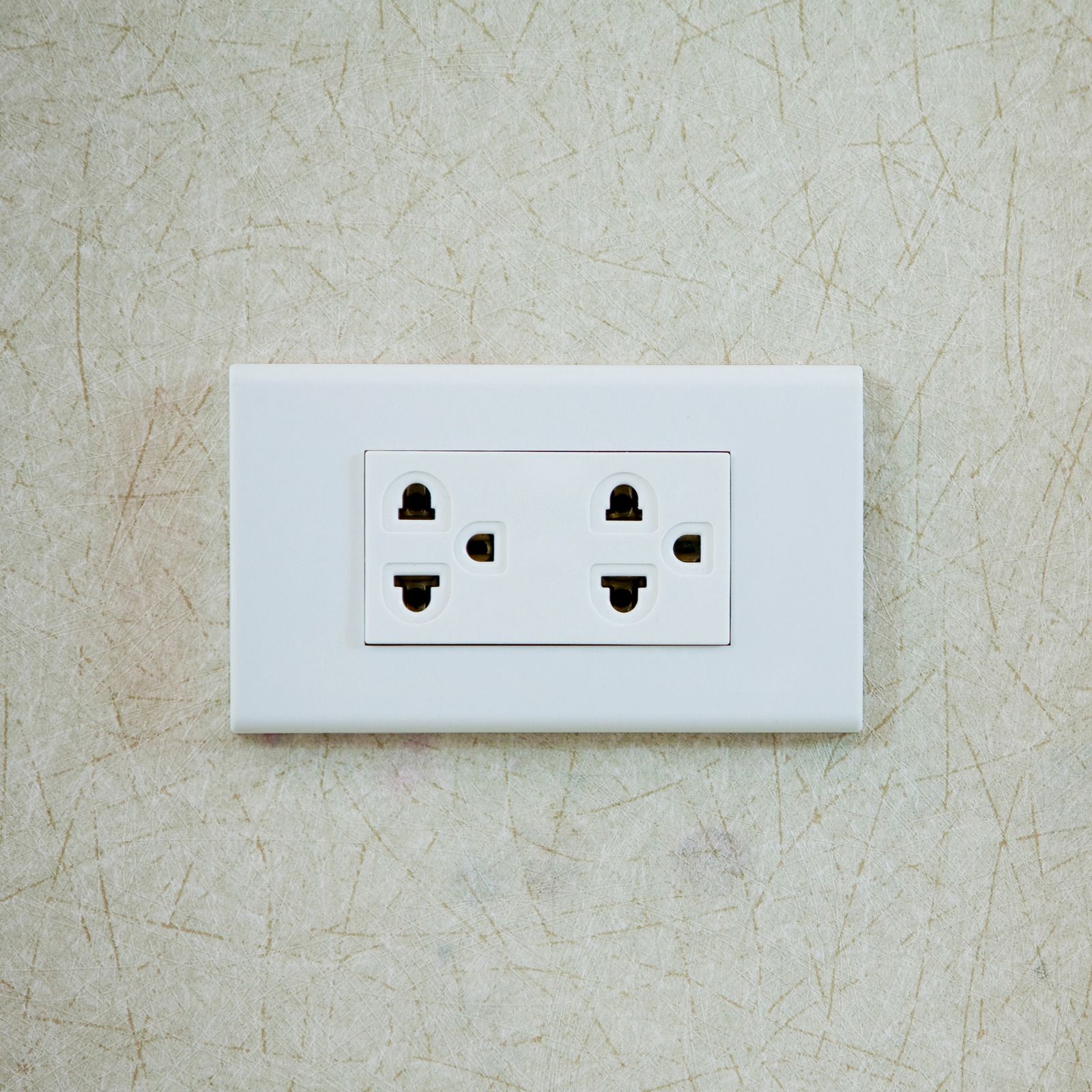 Electrical control panel with brown terminal blocks and wired connections on a white surface.