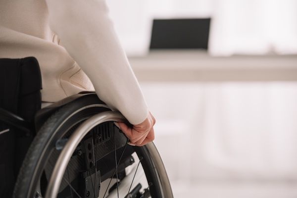 A person in a wheelchair in a hallway