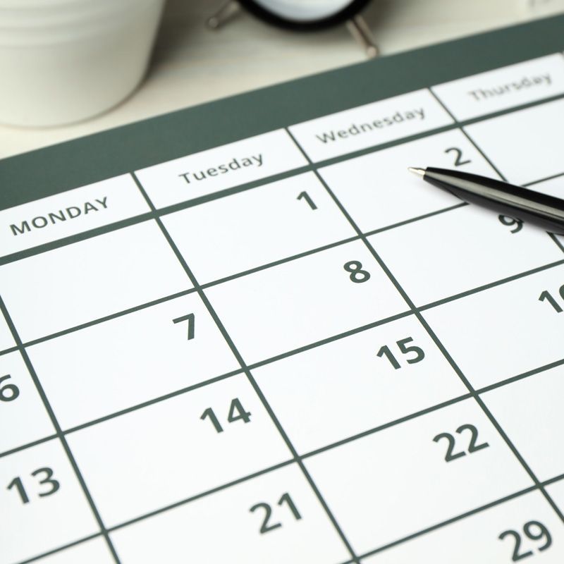 Blank calendar representing scheduled medical transfers and appointment planning.