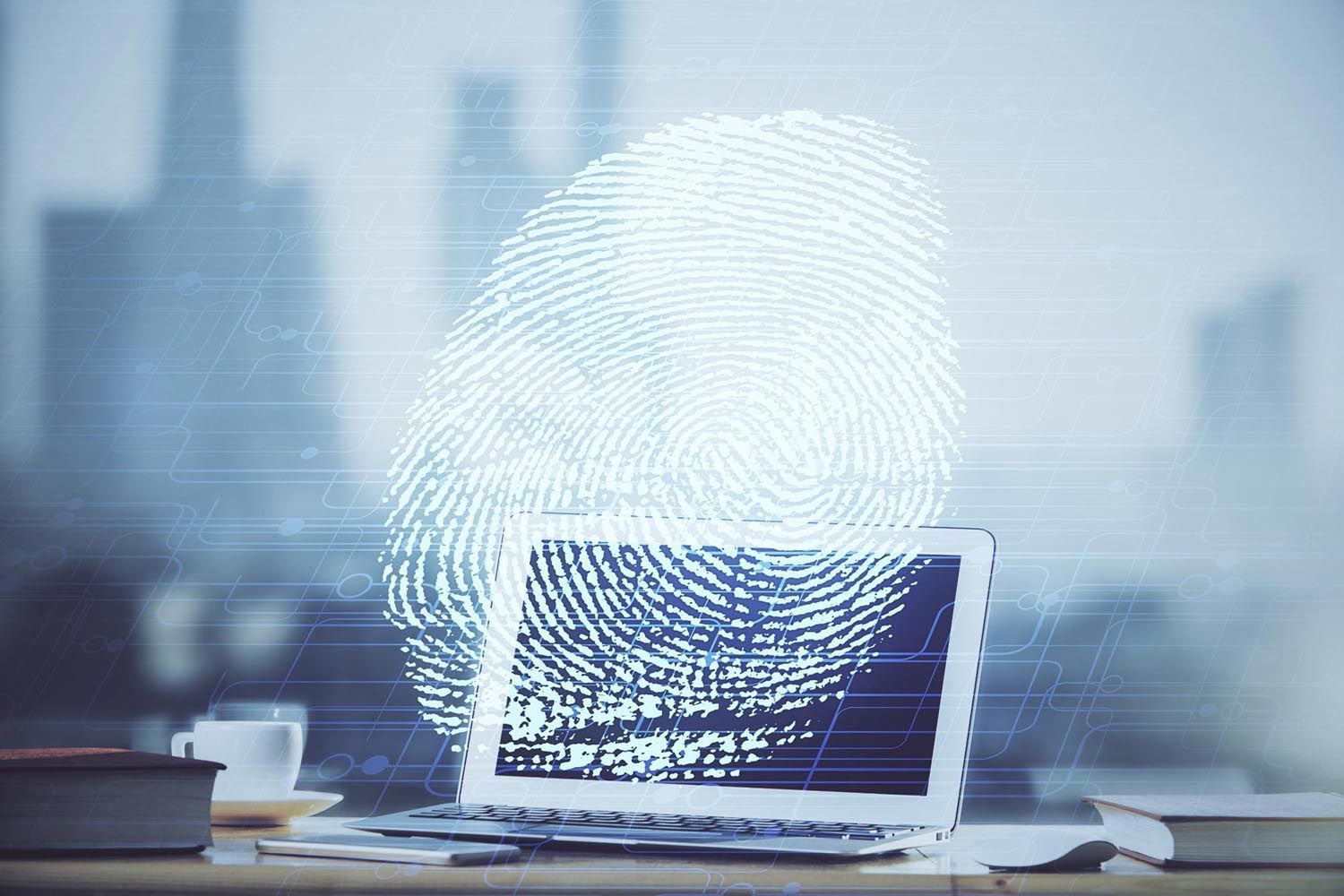 Laptop with fingerprint overlay, symbolizing digital security and identity verification.