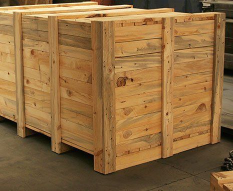 Stacked wooden shipping crates in a warehouse-like setting