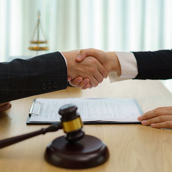 Lawyer and Customer Handshake After Good Deal Agreement — Edmonds, WA — Kimberly J. Macleod, P.C.