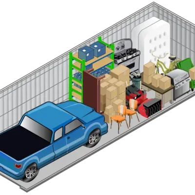 A blue truck is parked in a storage unit filled with boxes