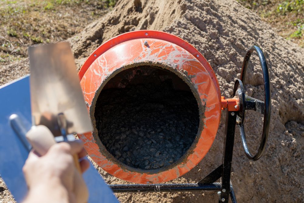 image of a motor mixer being used to mix concrete