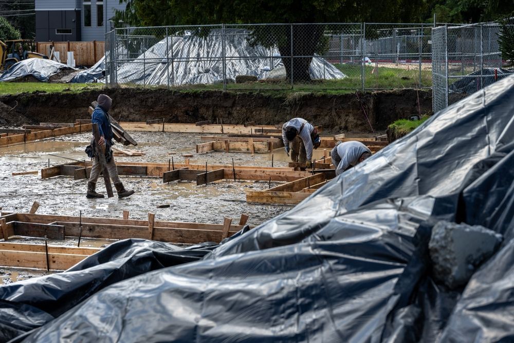 Pouring concrete in the rain.