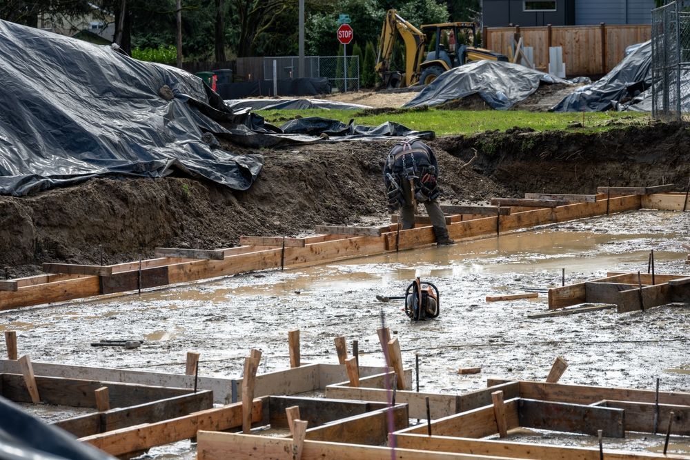 Pouring concrete in the rain.