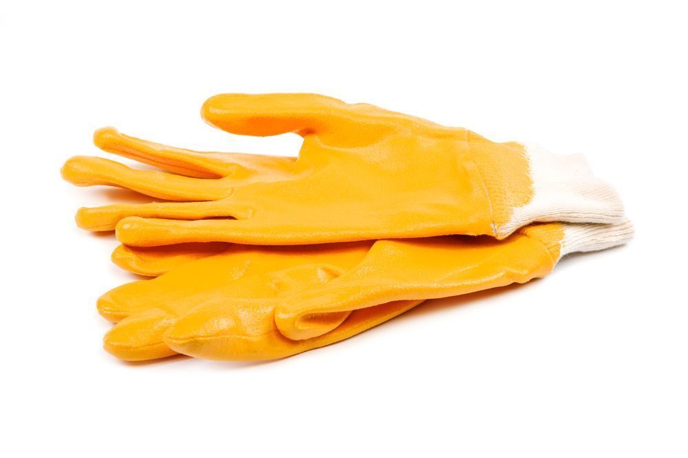 rubber gloves that are used by construction workers to mix concrete safely