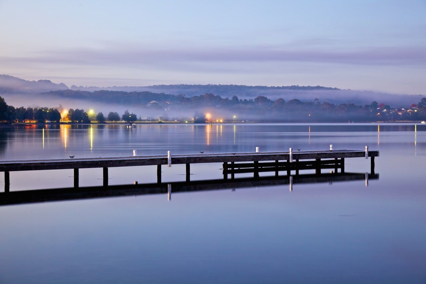 Dock Extending Into Calm Lake At Dusk — Refrigeration & Air Conditioning in Warners Bay, NSW