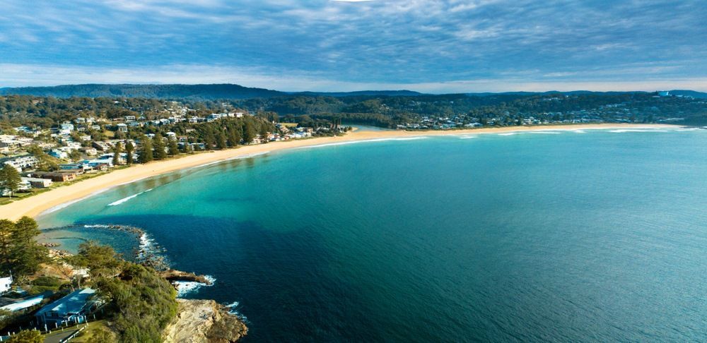 An Aerial View Of A Beach With Turquoise Water — Refrigeration & Air Conditioning in Central Coast, NSW