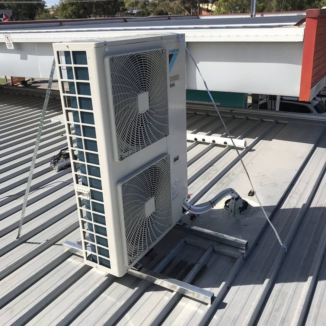 Air Conditioning Unit Mounted on a Corrugated Metal Roof – Refrigeration & Air Conditioning in Port Stephens, NSW