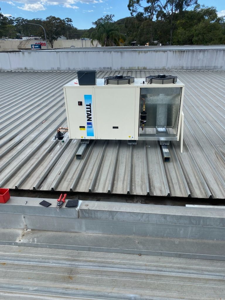 HVAC Unit on a Corrugated Metal Roof — Refrigeration & Air Conditioning in Central Coast, NSW