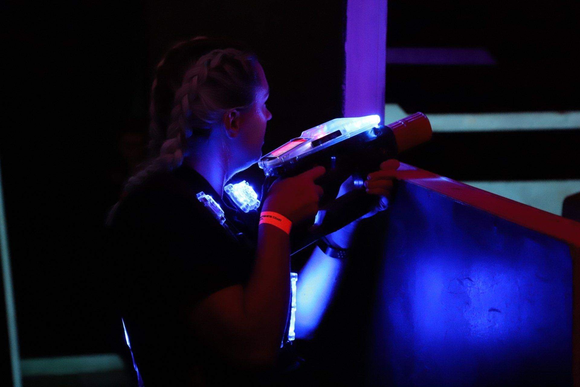 Adult female plays laser tag