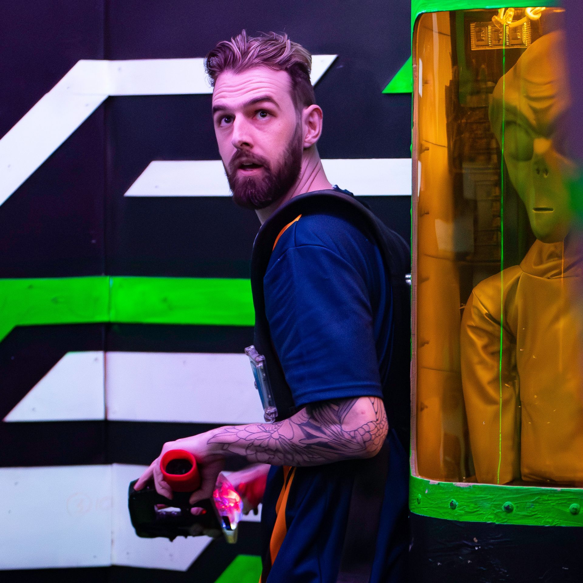 Young adult plays laser tag