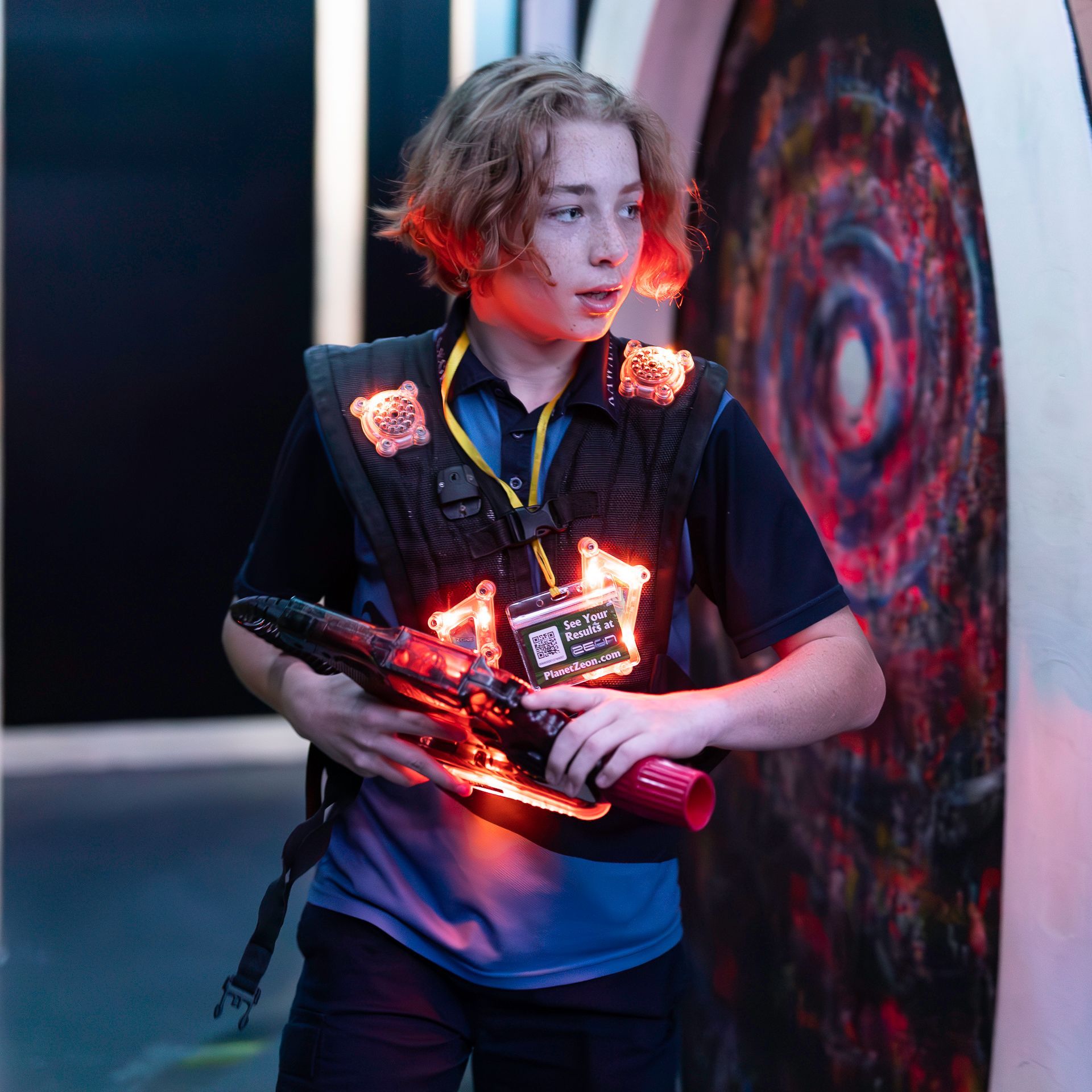 Teenager playing competitive laser tag
