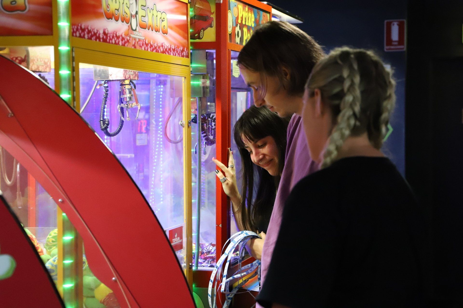 Group of young adults playing arcades