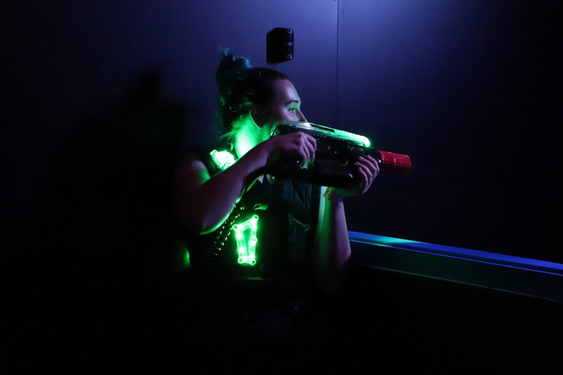 Adult female plays laser tag
