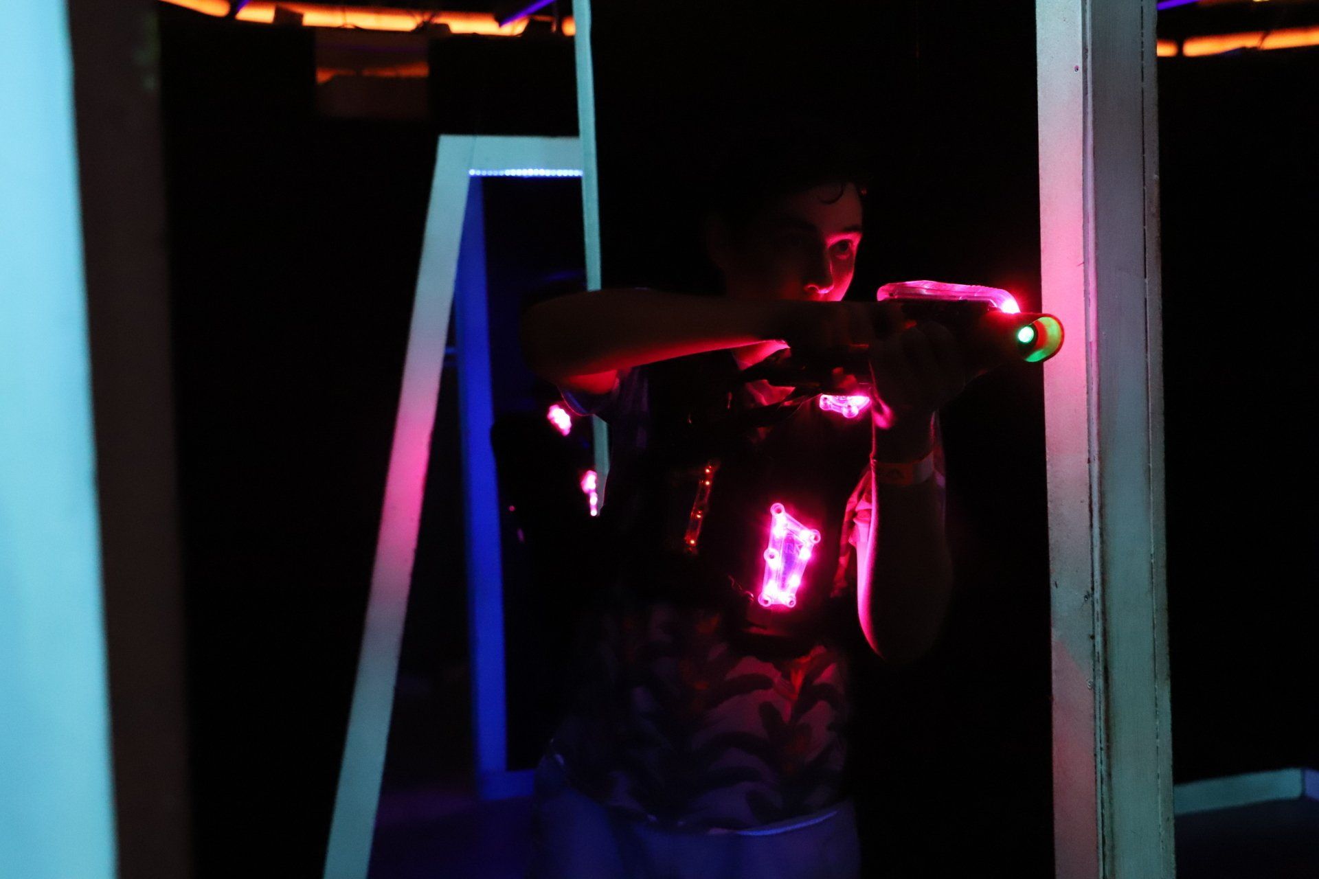 Adult plays laser tag