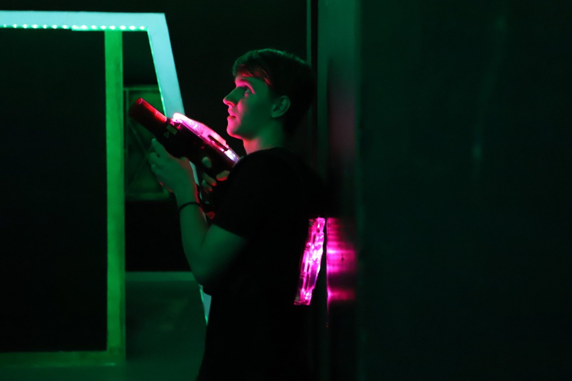 Adult male plays laser tag