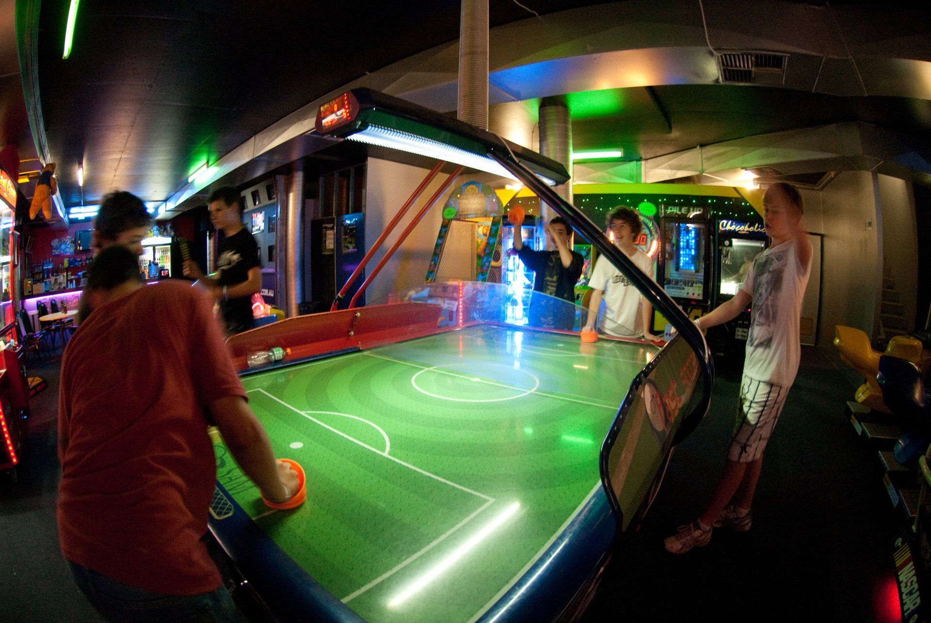 Group of youths playing arcades