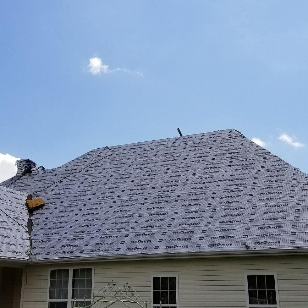 A house with a roof that is covered in shingles.