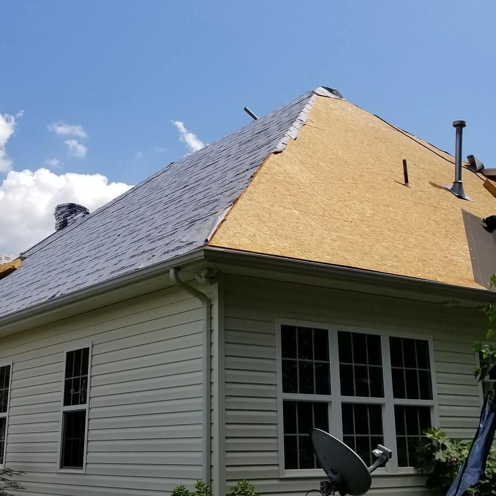 A house with a satellite dish on the side of it