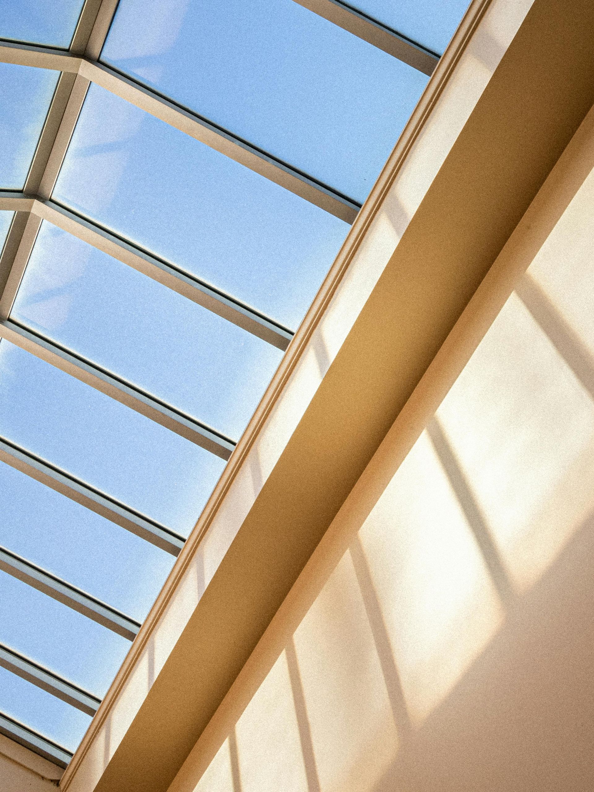 Two men are working on the roof of a house
