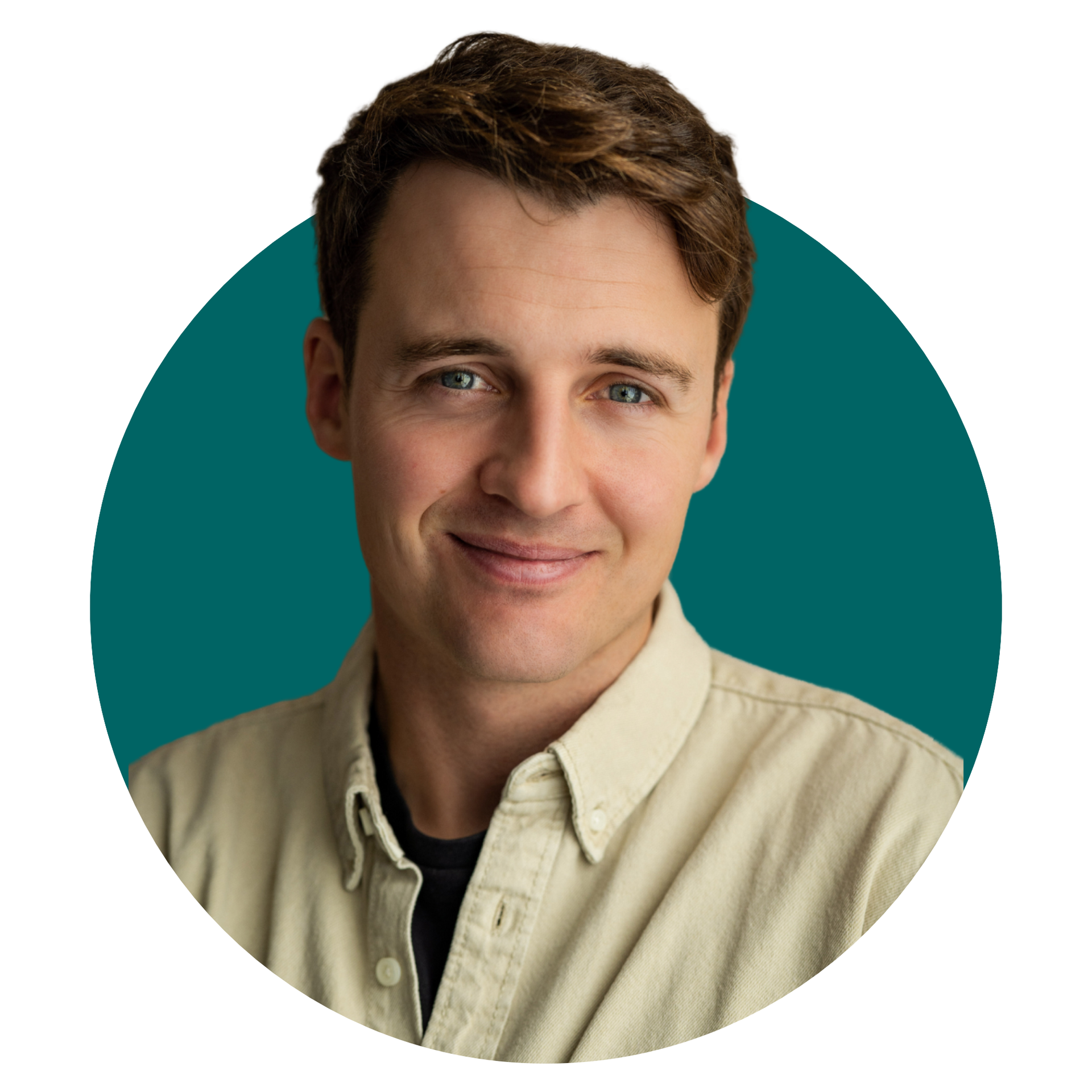 A man in a tan shirt is smiling in a circle.
