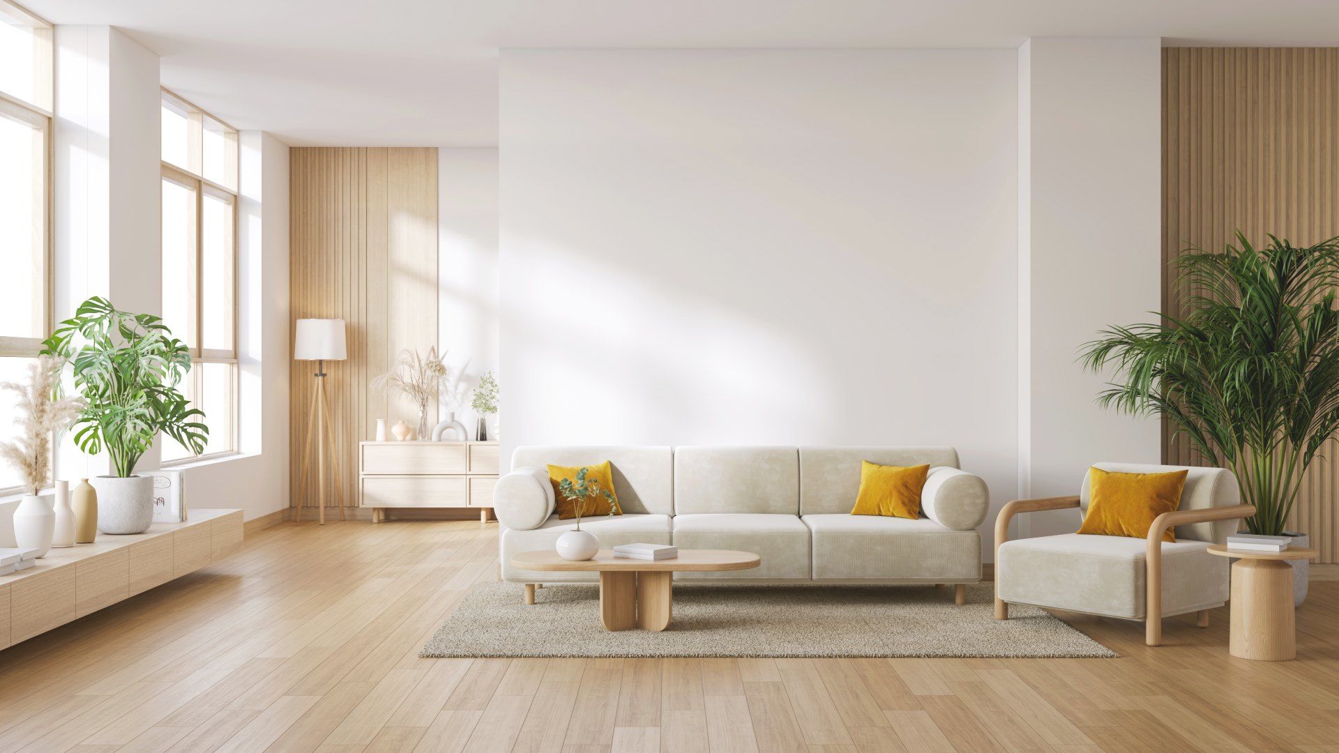 A living room with a couch , chair , coffee table and plants.