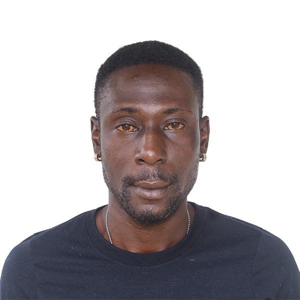 A man with a beard is wearing a black shirt