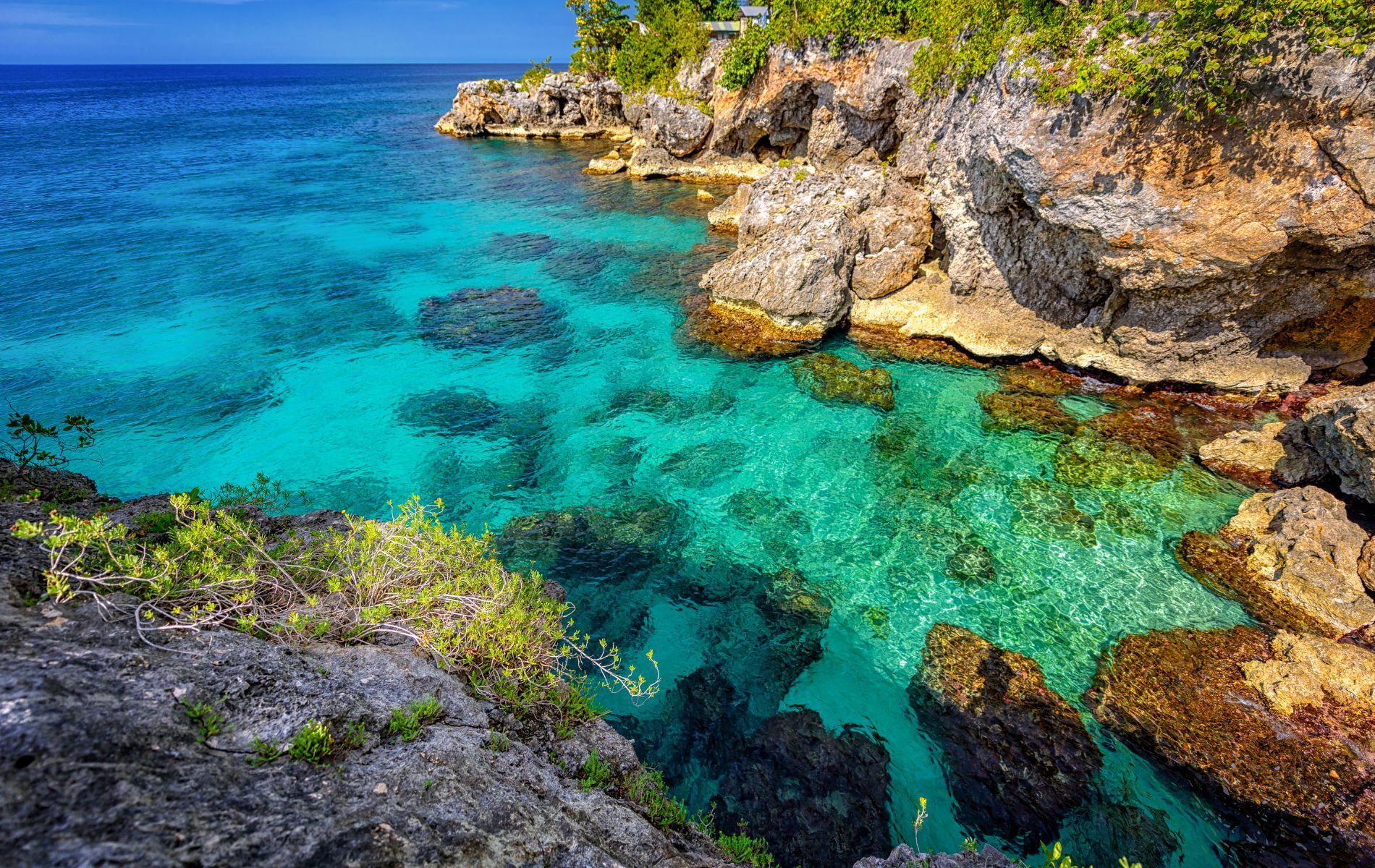 Tropical waters surrounded by rocky shorline