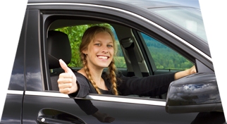 Girl giving thumbs up out of window