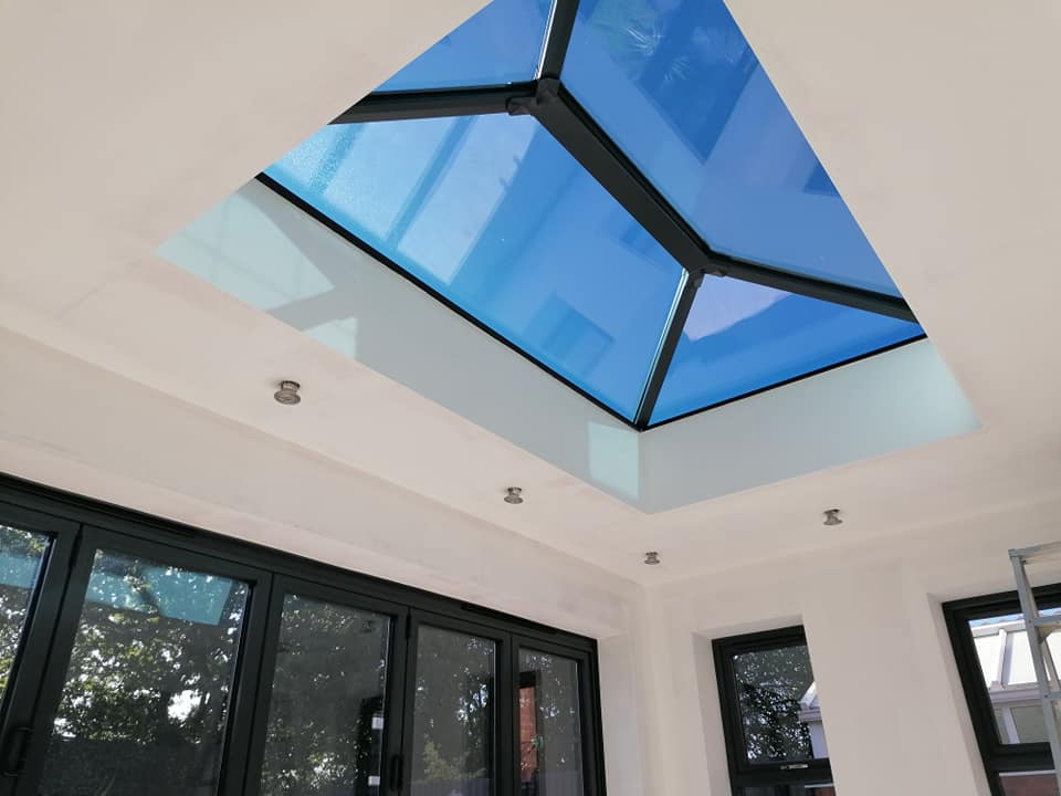 a room with a blue skylight in the ceiling