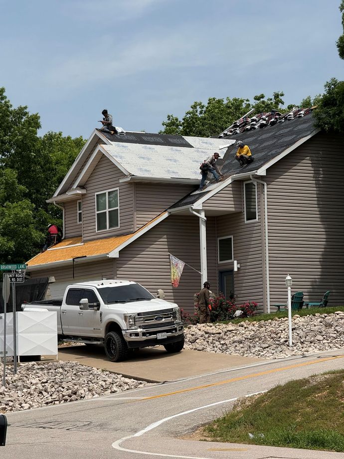 The roof of a house with a window on it