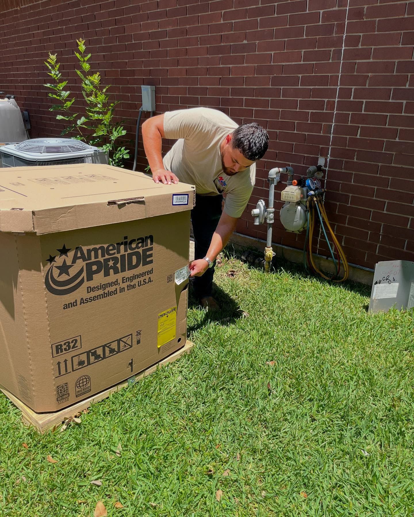 Man inspecting a large cardboard box labeled 