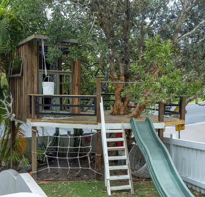 A Kitchen With A Large Island In The Middle Of The Room — JC Coastal Construction In Coorabell, NSW