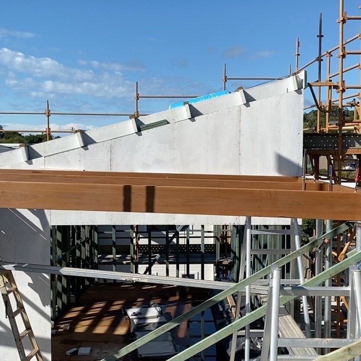 A Building Under Construction With Wooden Beams And Scaffolding — JC Coastal Construction In Coorabell, NSW