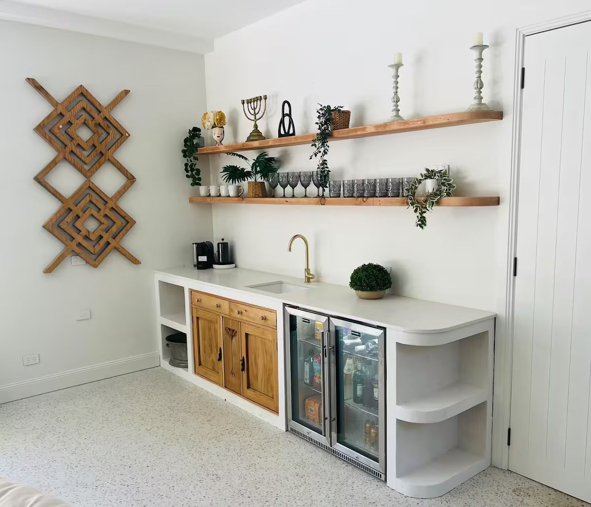 A Kitchen With A Large Island In The Middle Of The Room — JC Coastal Construction In Coorabell, NSW
