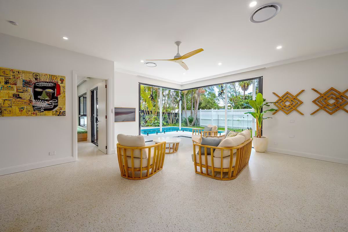A Outside Area With A Couch And Chairs And A View Of The Sunset — JC Coastal Construction In Coorabell, NSW