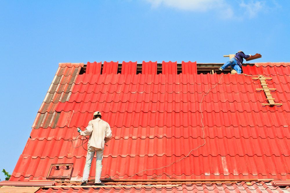 Two Man Repairing Red Roof — Roofing In Tweed Heads, NSW
