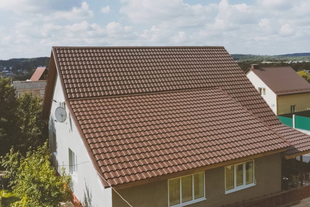 Brown Metal Tile On The Roof Of The House — Roofing In Tweed Heads, NSW