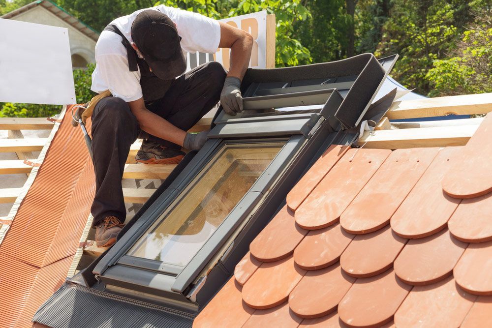 Skylight On A New Roof Of Red Tiles — Roofing In Ballina, NSW