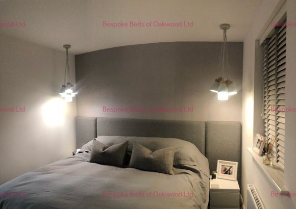 View of soft cushion headboard with hanging lights