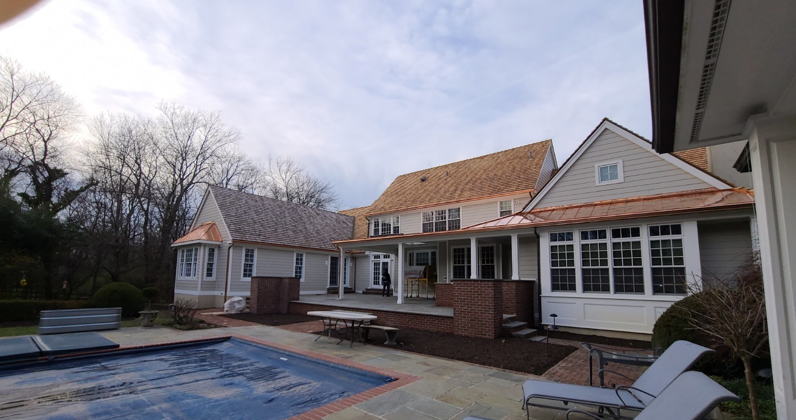 Backyard of a home with  a covered pool