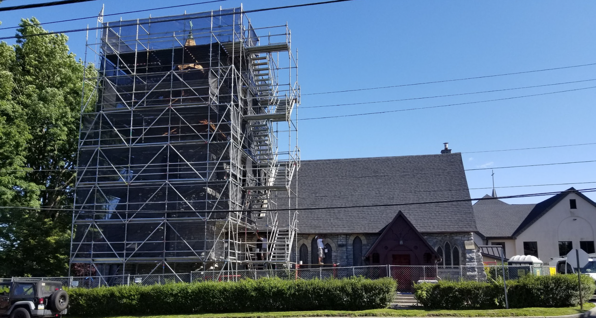 Scaffolding outside a church during exterior painting project.