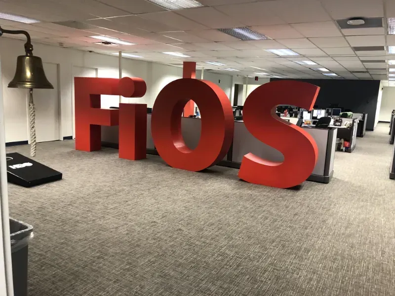 A large red fios sign in an office