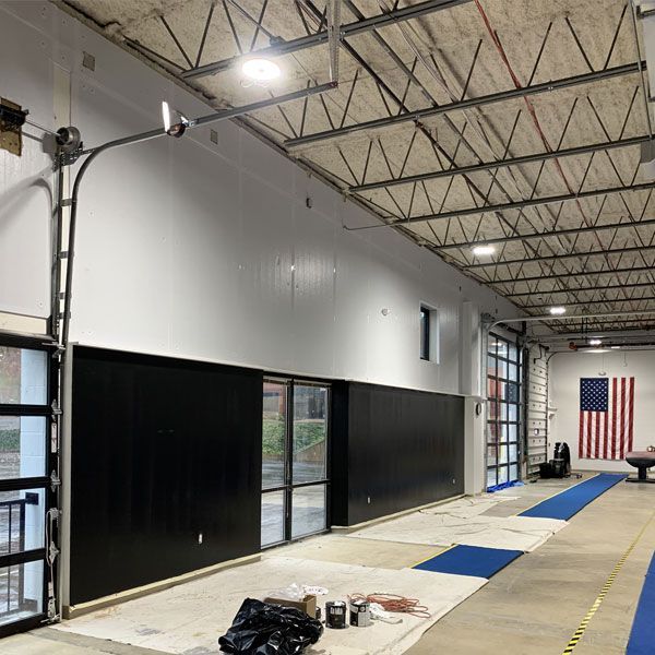A large room with a large american flag on the wall.