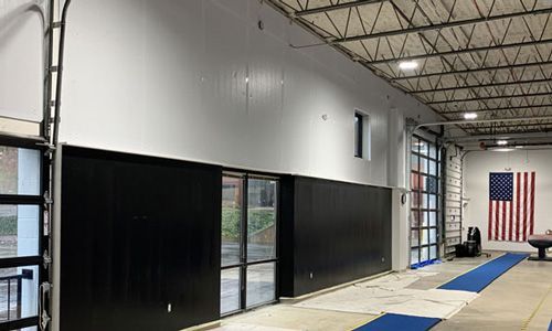 A large room with a large american flag on the wall.