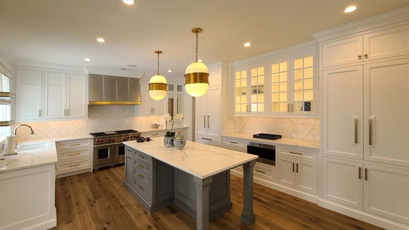 There is a large island in the middle of the kitchen.