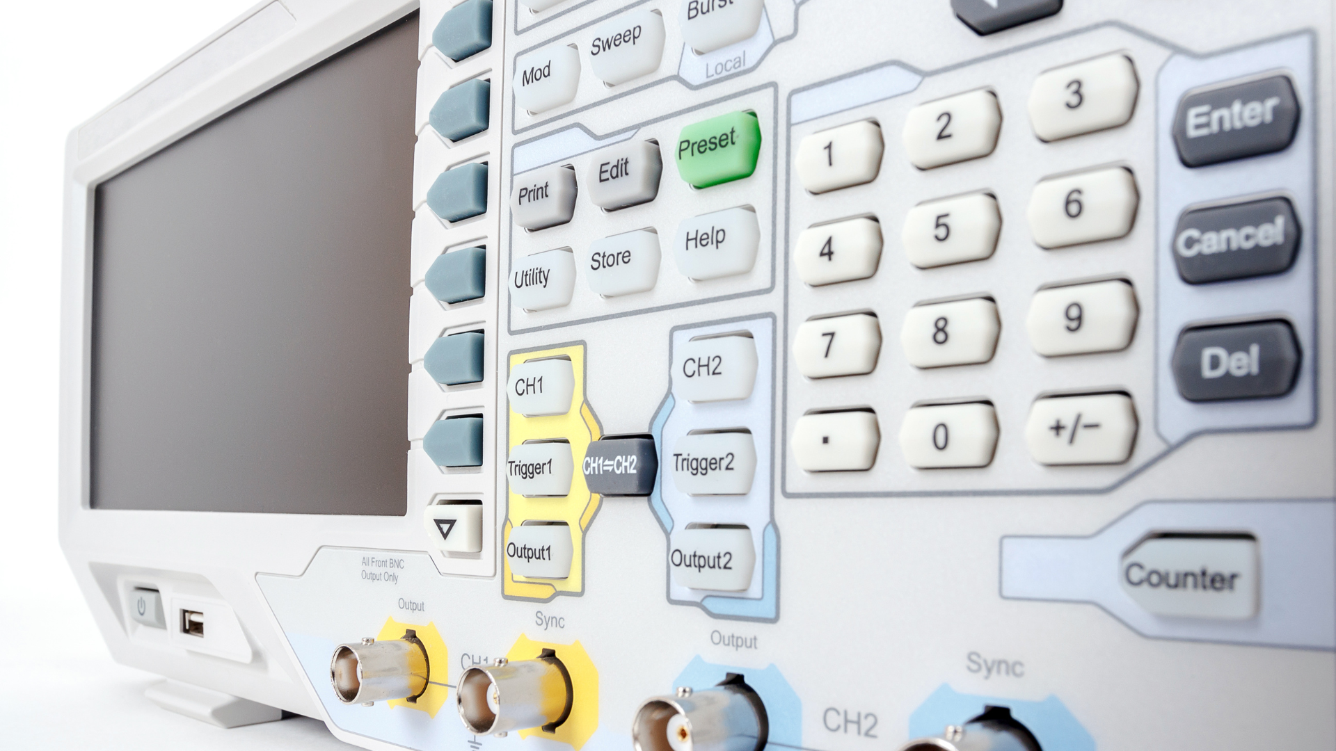 A close up of a digital oscilloscope with many buttons